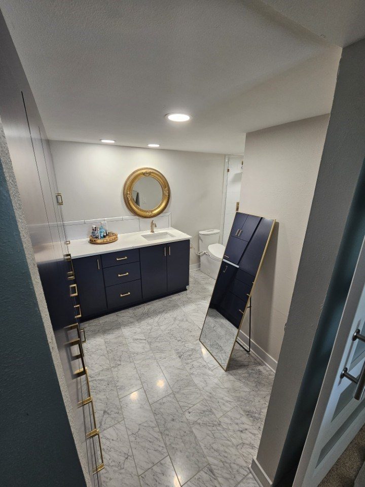 Bathroom remodel with navy vanity