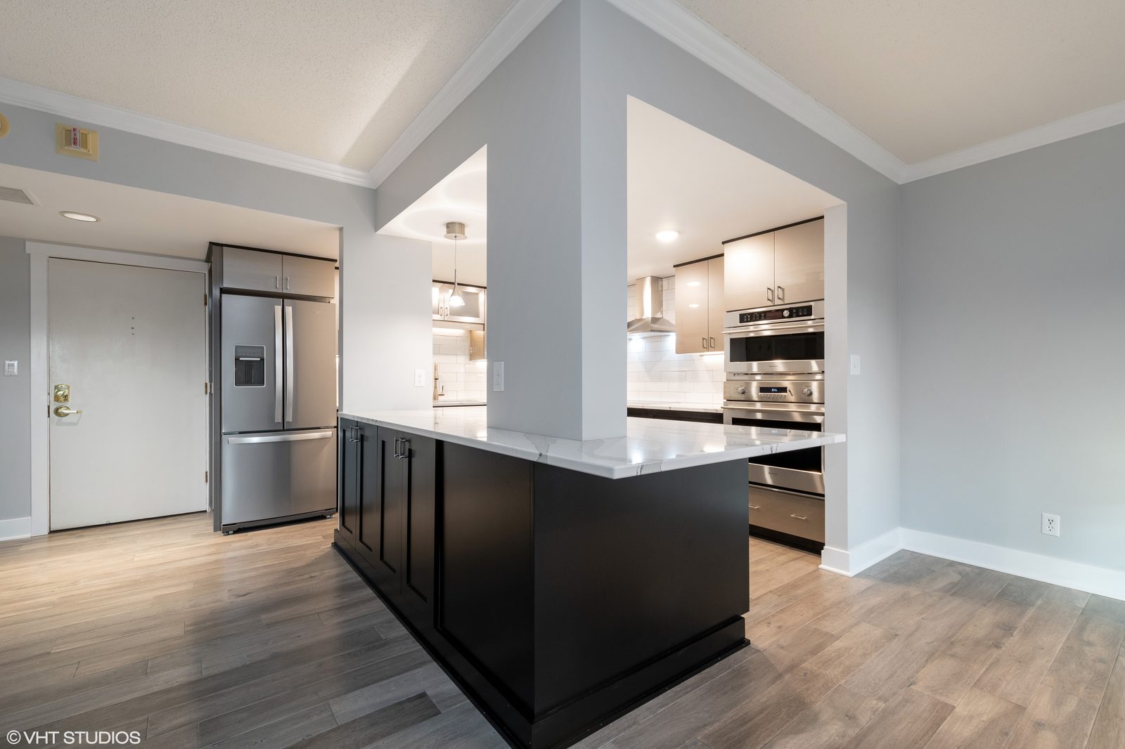 Modern condo kitchen remodel with black island