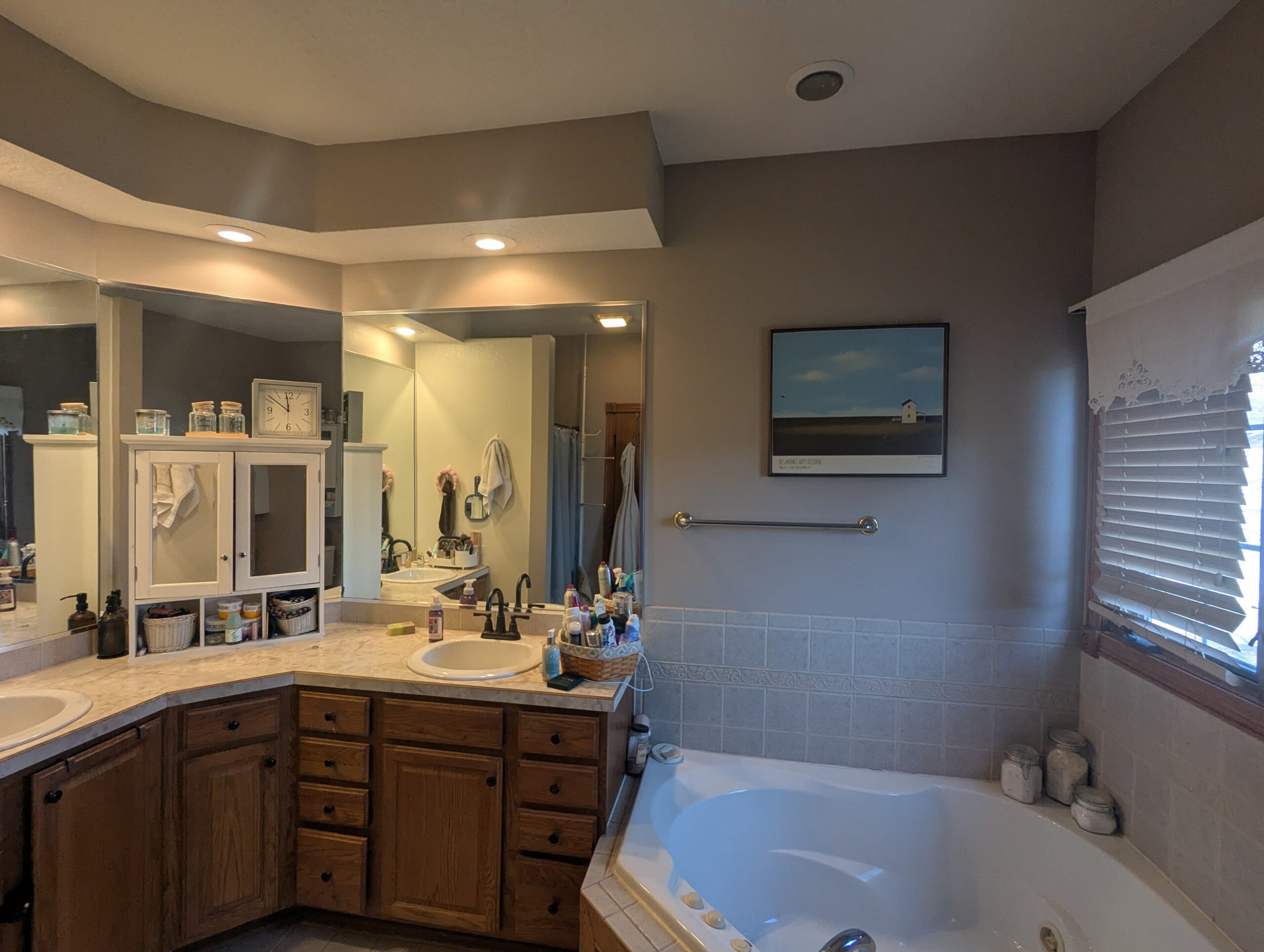 Old corner vanity with laminate counter before the remodel